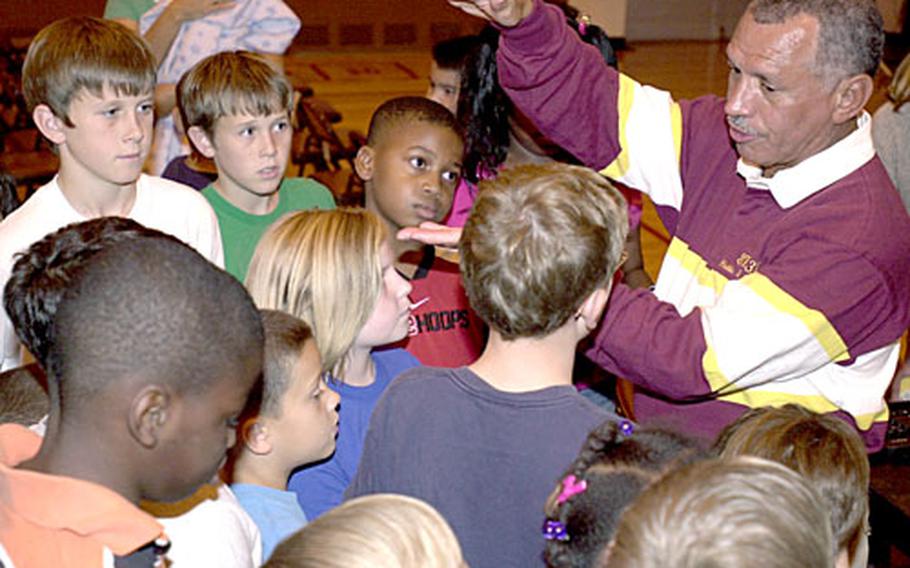 Retired Maj. Gen. Charles F. Bolden Jr., a former astronaut, answers some questions about life in space after speaking to students and their families at Zukeran Elementary School on Camp Foster Monday.