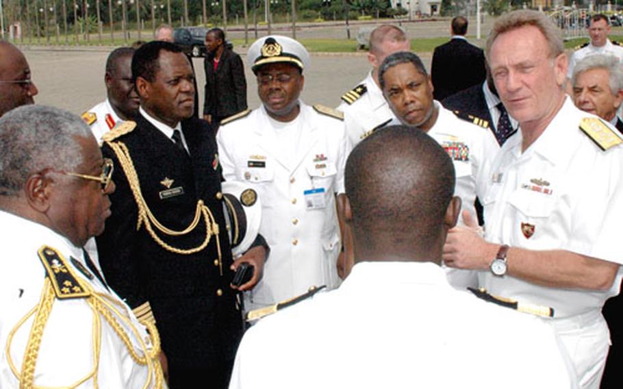 Adm. Harry Ulrich, commander of U.S. Naval Forces Europe, right, meets with naval operations officials from West and Central Africa at Maritime Safety and Security in the Gulf of Guinea Ministerial Conference, which took place earlier this week in Benin.