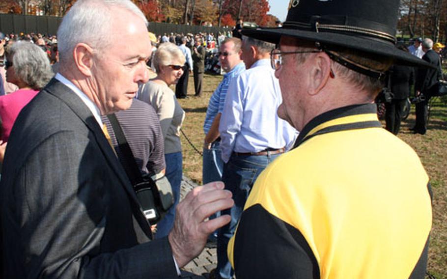 Retired Army Gen. Barry McCaffrey, left, talks to a veteran before last weekend's Veterans Day ceremony at the Vietnam memorial in Washington, at which he was one of the speakers. McCaffrey said Friday that the all-volunteer force could be “severely degraded” within two years unless major recruiting and retention reforms are made soon.