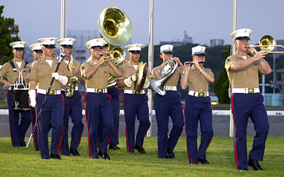 The III Marine Expeditionary Force Band performs during the change-of-command ceremony Sept. 6 in which Brig. Gen. Mary Ann Krusa-Dossin accepted command of Camp Butler and the position of deputy commander of Marine Corps Bases, Japan.