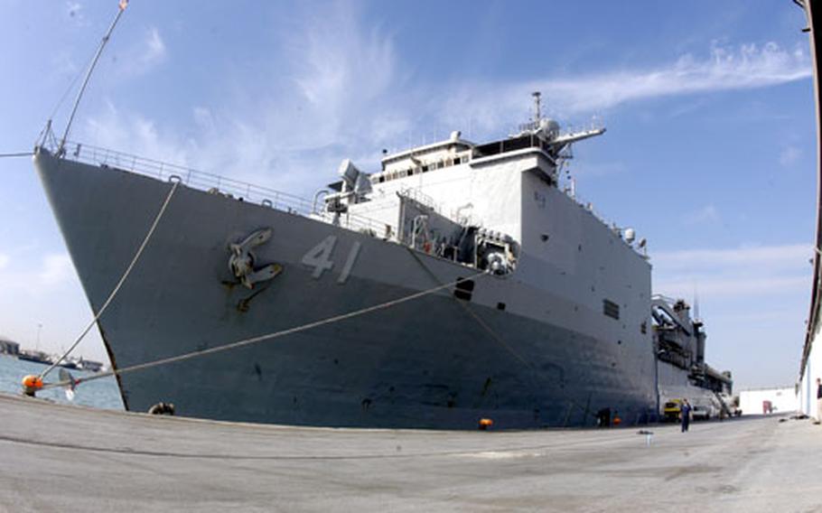 The big-deck amphibious dock landing ship USS Whidbey Island sits pierside Saturday in Tunis, Tunisia.