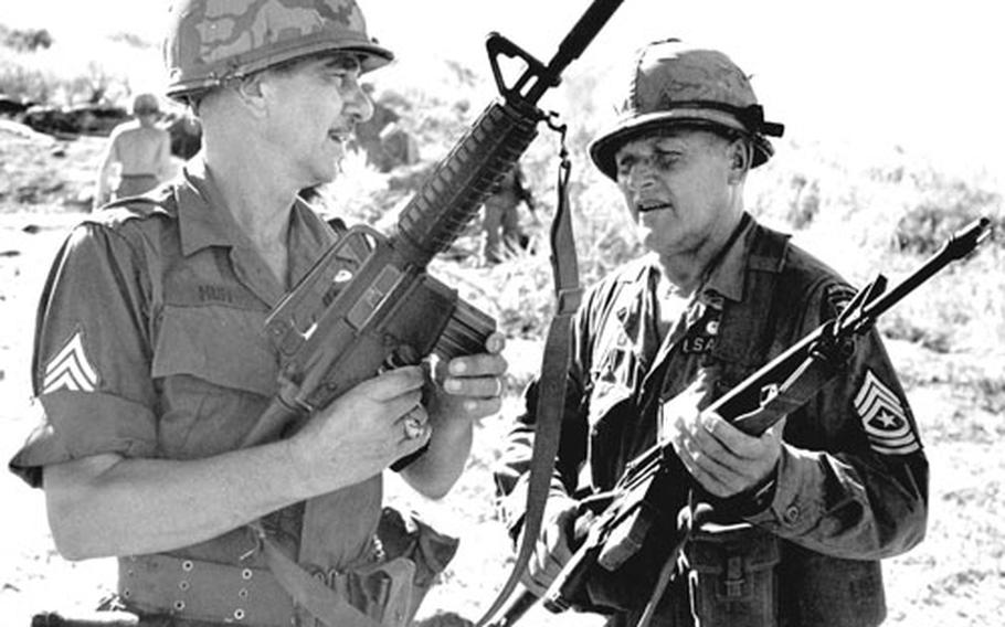 Sgt. Maj. Paul B. Huff, left, and Sgt. Maj. Walter T. Sabalauski meet in the field during an operation by the 1st Brigade, 101st Airborne Div., near Duc Pho, South Vietnam, in 1967.