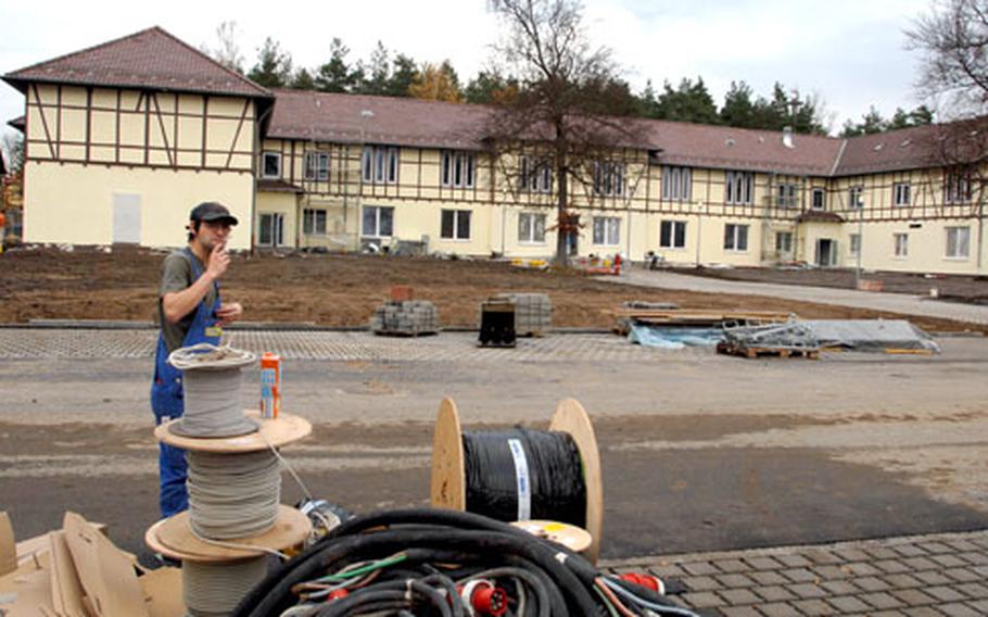 A construction worker takes a break outside the new U.S. Army Garrison Grafenwöhr headquarters, which is scheduled to open in January.