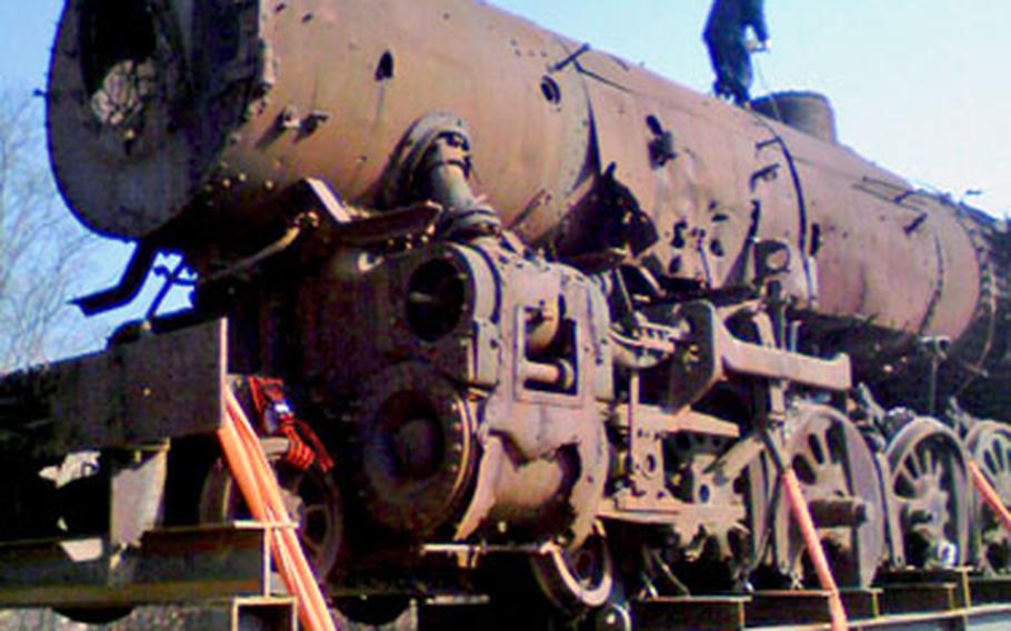 A rusty locomotive that once pulled cars from Seoul to the Chinese border gets transported out of the Demilitarized Zone, where it has remained stationary for almost 56 years.