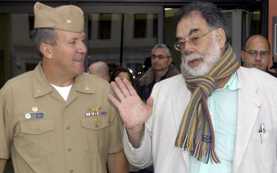Movie director Francis Ford Coppola talks with the commanding officer of Naval Support Activity Naples, Italy, Capt. Floyd Hehe, about Coppola's Italian ancestors, including a grandfather who was a popular Neapolitan song writer.