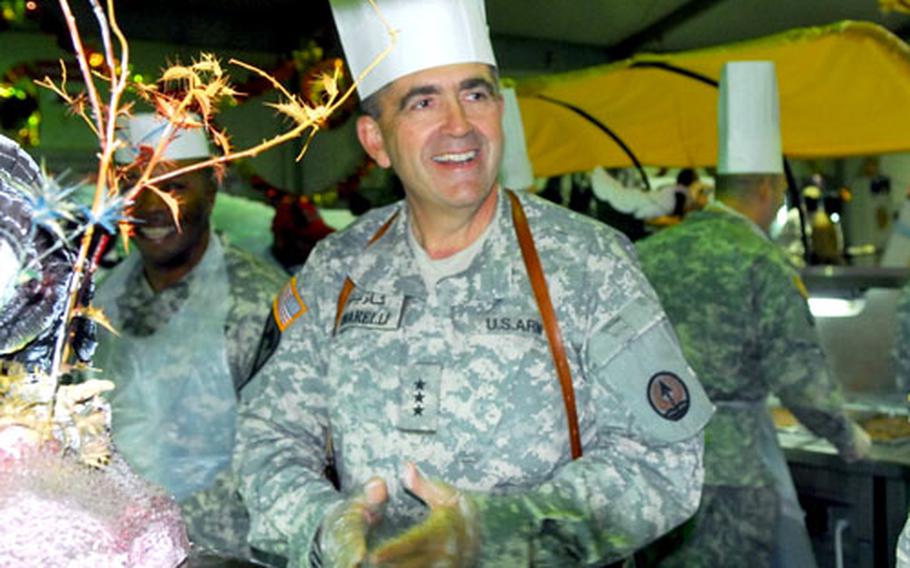 Lt. Gen. Peter W. Chiarelli, commander of Multi National Corps Iraq, served up turkey and other holiday staples during a visit to Camp Speicher near Tikrit, Iraq, on Thursday.