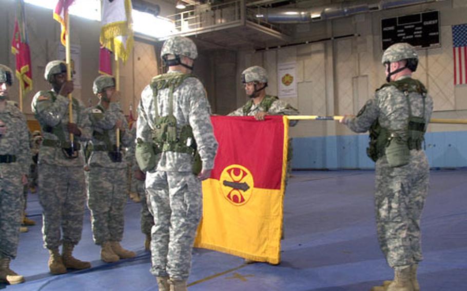 Soldiers from the 210th Fires Brigade perform a re-flagging ceremony at Camp Casey, South Korea, on Wednesday morning.