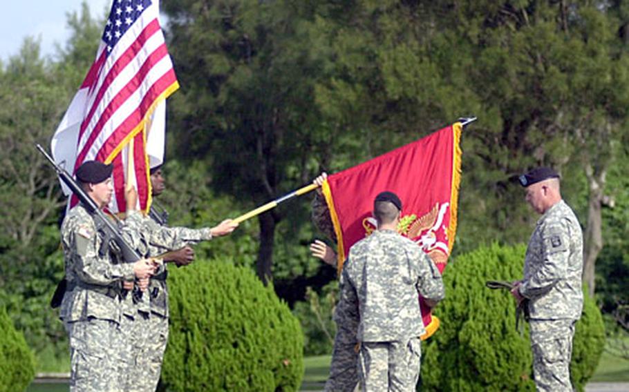 Soldiers with 1st Battalion, 1st Air Defense Artillery uncase the unit’s colors for the first time on Okinawa during an activation ceremony at the 18 Wing’s headquarters on Kadena Air Base on Thursday.