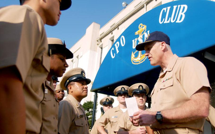 Yokosuka Naval Base command chaplain Cmdr. Bob Freiberg accepts $5,000 for the USS Oneida project from the 2007 class of chief petty officers.