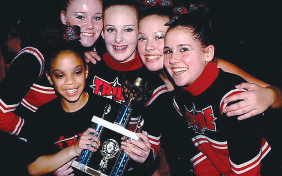 From left, Chayla Walton, Jade Snedeker, Ellie Martin, Mariyah Senter andCheyanne Plewe of the Lakenheath Youth Program’s cheerleading squad, the Thunder Birds, pose with one of their trophies at the Winter Wonderland Cheer and Dance Championship in London on Saturday. The junior squad is part of the Tribe, which brought home five top-three finishes in the annual competition.