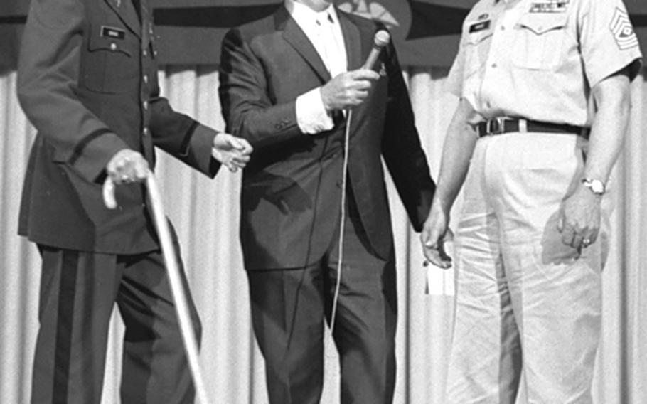When 1st Sgt. Thurman E. Grigg from Butzbach, Germany, was called to the stage by host Art Linkletter during a filming of "House Party," he was told it was to accept a door prize. Instead, he got a reunion with his son, 1st Lt. Donald E. Grigg, who was flown to Frankfurt from Fort Sam Houston, Texas, where he was recovering from wounds suffered in Vietnam.