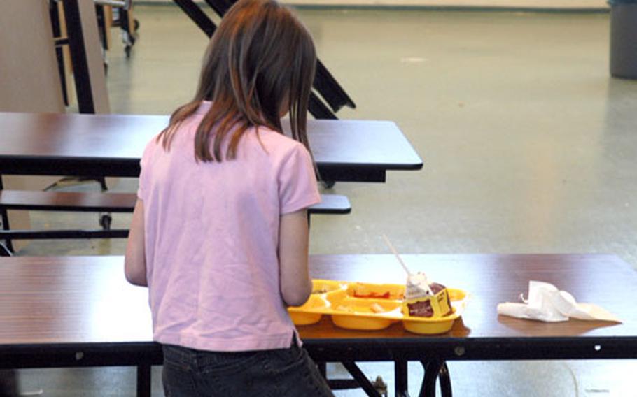 One of the last students to receive her lunch finishes up at Patch Elementary School on Thursday. Principal Robert Allen said he wants to change the current lunch schedule so students won’t be late for class. Some students don’t receive their meals until there is less than 10 minutes left in their 30-minute lunch break.