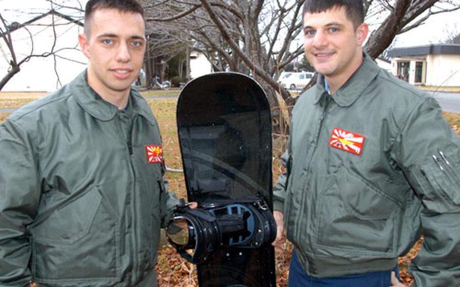 Seaman Jason Pratt, left, and Petty Officer 1st Class Steven Jarrells stand on Misawa Air Base, Japan, after they spent almost 24 hours lost in the freezing Hakkoda mountains.