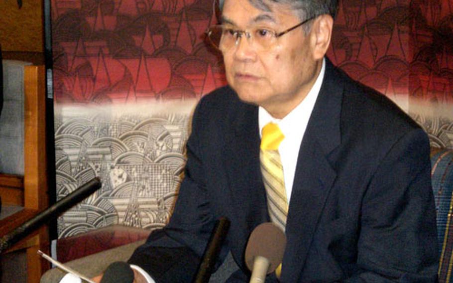 Okinawa Gov. Keiichi Inamine speaks to reporters Friday during his last news conference as governor.