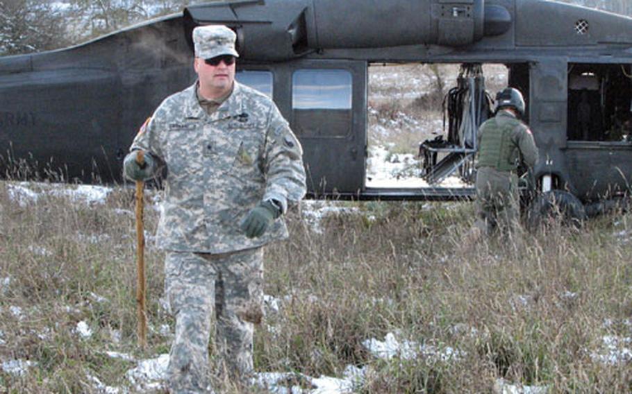 Brig. Gen. Douglas B. Earhart, commander of the Army National Guard’s 29th Infantry Division and new commander of Kosovo Forces Multi-National Task Force (East), exits his aircraft to tour the training area at Hohenfels, Germany, during KFOR 8’s mission rehearsal exercise in early November. He cautions that the next few months in Kosovo could be tense as the province’s future national status is decided.