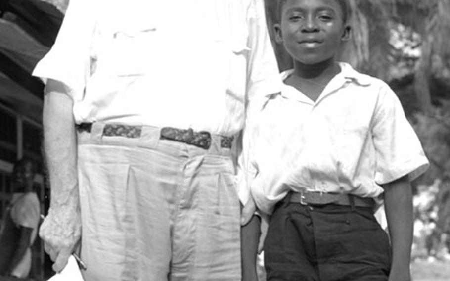 Saturnin Onah says goodbye to Dr. Albert Schweitzer at Lambaréné, Gabon.