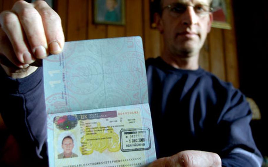 Tom Gable shows off his British visa days after he arrived in the United Kingdom to be reunited with his British wife. The former airman previously was denied the visa based on a few disparaging sentences he wrote about President Bush in a letter submitted as part of the application, but a judge reversed that decision.