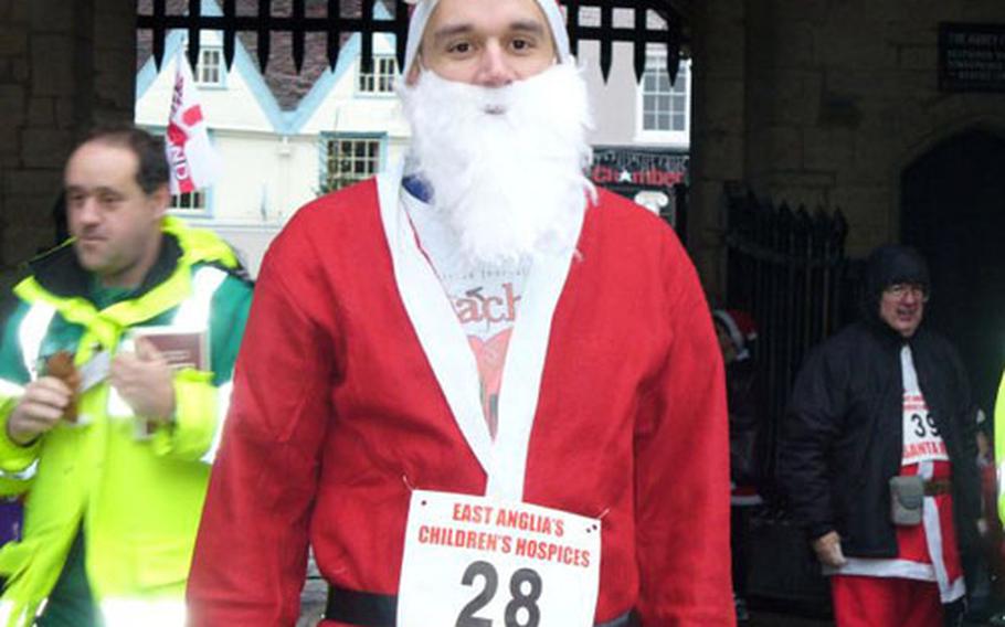 Wearing a Santa Claus outfit, Staff Sgt. Joshua Bauman poses for a photo before the East Anglia Children's Hospices charity run on Dec. 2.