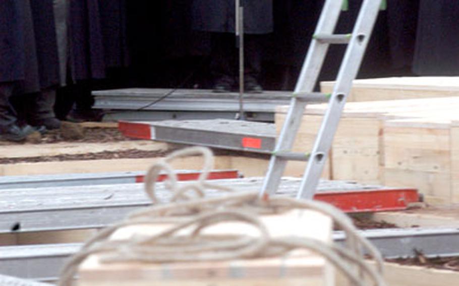 Rabbi Netanel Wurmser of the Stuttgart, Germany, New Synagogue speaks at the Dec. 2005 funeral of 34 Holocaust victims whose remains were discovered in September 2005 at Stuttgart Army Airfield. Jewish community leaders have announced that a memorial will be unveiled in April to honor the victims.