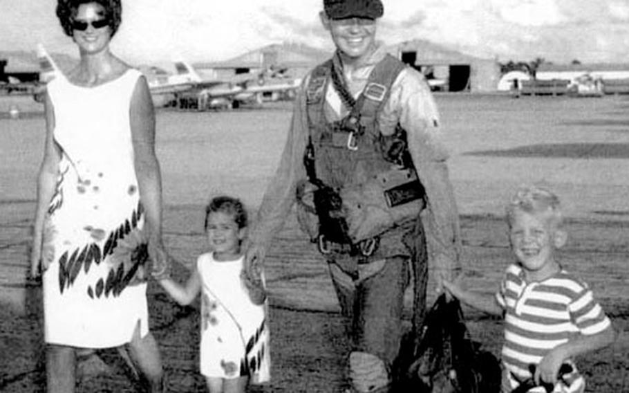 Anne, Jenny, David and Jeff Johnson, in a family photo taken right before Capt. Guy "David" Johnson went to Vietnam aboard the USS Kitty Hawk in 1965.