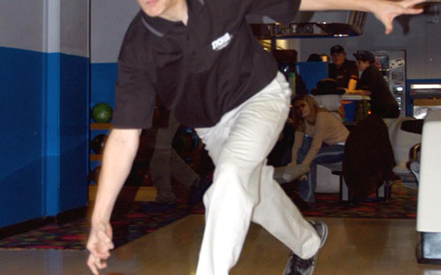 Lakenheath High School sophomore Dennis Patton shows off the roll that earned him a perfect 300 game.