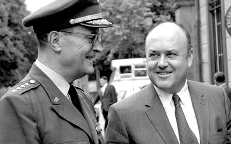 Secretary Laird talks with Gen. Earle Wheeler at Brussels, where the NATO Defense Planning Group was meeting.