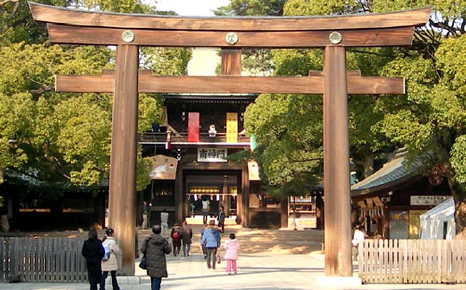 Visitors to the Meiji Shrine in Tokyo walk under the large Torii Gate near the shrine’s entrance. Japanese visit a temple on New Year’s Eve to strike a bell 108 times to wipe away all the bad things that happened of the past year and to purify one’s spirit.