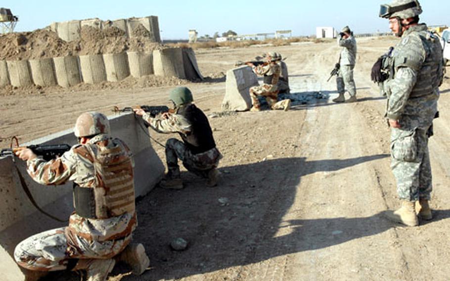Sgt. 1st Class Leroy Notterman, 48, an Army reservist with the 382nd Military Police detachment in San Diego, Calif., supervises members of an Iraqi reconnaissance platoon during range training Thursday at the Iraqi Army’s 9th Division headquarters, Al-Rasheed Army Base. Notterman, who is a supervisory border patrol agent at Boulevard Station, Calif., is from Campo, Calif.