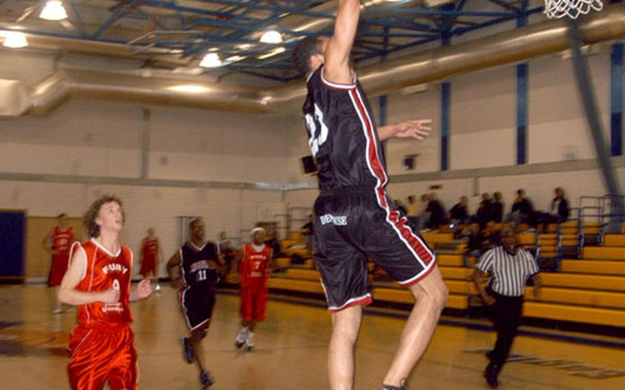 Mildenhall’s Corey Fletcher goes up for a dunk during the championship game of the Dave Allen Basketball Tournament.