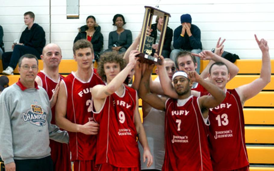 The Kings Lynn team poses with the championship trophy after winning the Dave Allen Basketball Tournament.