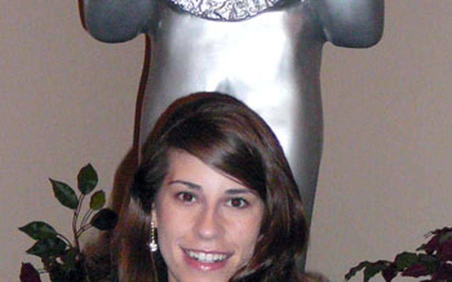 2nd Lt. Kimberly Robinson stands in front of the “Roger” statue, which is the symbol of the Air Force’s Worldwide Talent Contest. The RAF Lakenheath officer from Del Rio, Texas, impressed judges at the competition to land a spot on the 2007 Tops in Blue tour.