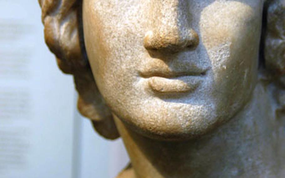 A bust of Alexander the Great, the legendary Macedonian conqueror, cast in his traditional half-turned pose.
