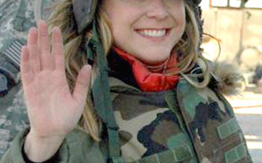 Actress Karri Turner, who plays Lt. Harriet Sims on the television series “JAG,” arrives Forward Operating Base Loyalty to meet servicemembers and wish them a happy New Year.