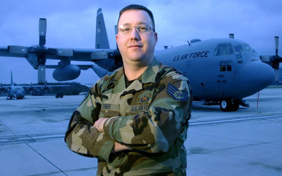 Staff Sgt. Benjamin Comer, a dedicated crew chief assigned to the 86th Aircraft Maintenance Squadron, poses Wednesday in front of his aircraft the day before it retires from active duty at Ramstein Air Base, Germany. The C130E, nicknamed “Ace of Spades,” is being flown to the Aerospace Maintenance and Regeneration Center, known as the “bone yard,” in Arizona after 42 years of service. Tail No. 7887 started its career with five years of service in Vietnam.
