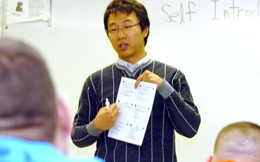 Ma Kyung-won helps soldiers with introductory language lessons during an orientation program last month at Camp Henry, South Korea.