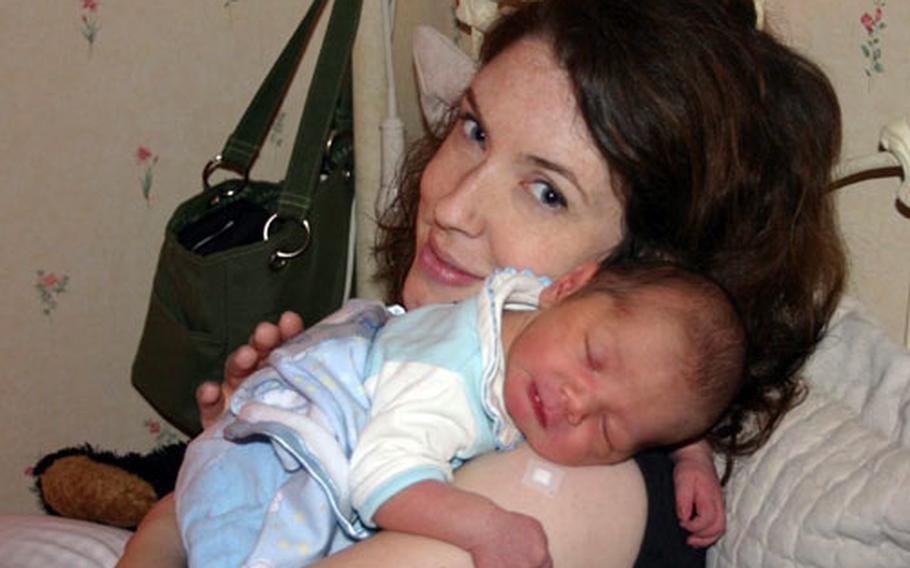 Erin Wang holds baby Jayden at the Higashijima Ladies Clinic in Sasebo last summer. Wang, who speaks Japanese, experienced some of the main differences between care in a Japanese facility and in a stateside hospital, including what she called “an old-school method of getting the baby out.”