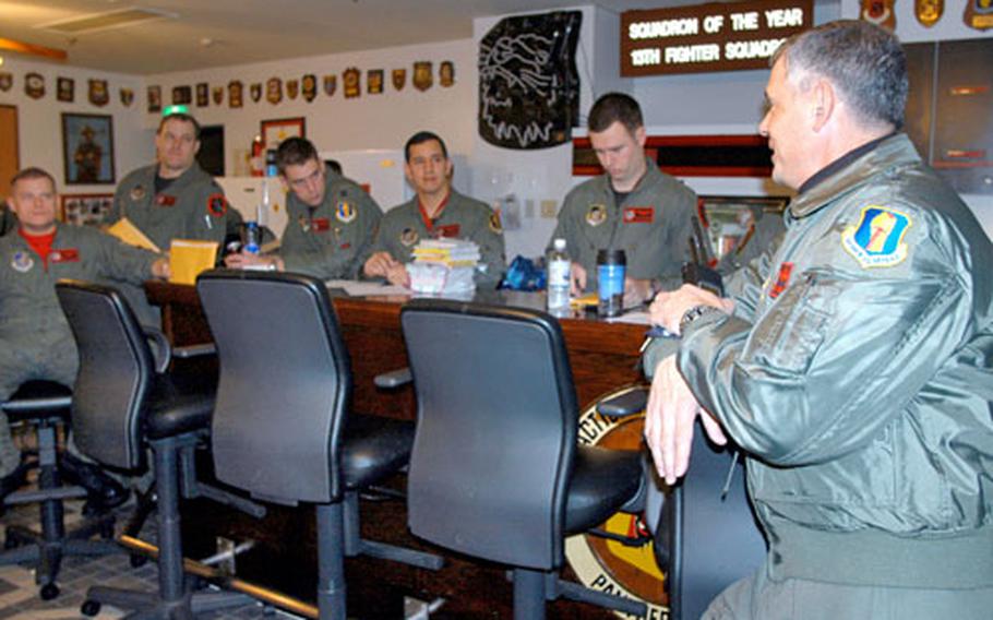 Brig. Gen. Sam Angelella, the outgoing 35th Fighter Wing commander at Misawa Air Base, Japan, bids pilots with the 13th Fighter Squadron farewell and wishes them good luck prior to their deployment early Friday morning to Red Flag.