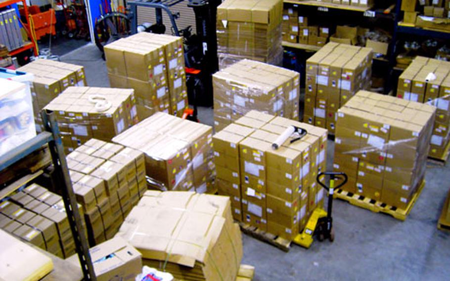 Boxes filled, sealed and addressed sit in a warehouse near Tampa, Fla., waiting to be mailed by Bob Williams. Each week, he sends about 215 boxes to troops at some 200 combat-zone bases.