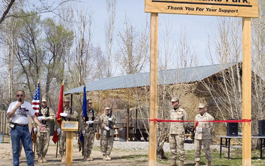 Bob Williams, left, speaks during a visit to the Bob Williams Park on Manas Air Base in Kyrgyzstan.