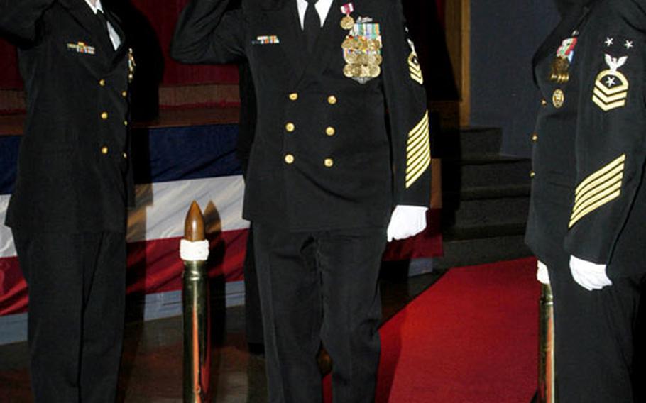 Command Master Chief Gary Bernhard was piped ashore during his retirement ceremony Dec. 15, 2006 at Yokosuka&#39;s Fleet Theater.