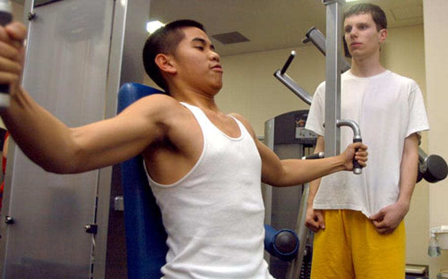 Getting "beast" for the new year is a goal for high school students Ronald Ceballos and Matt Duncan, who were working out at Yokosuka Naval Base Monday.