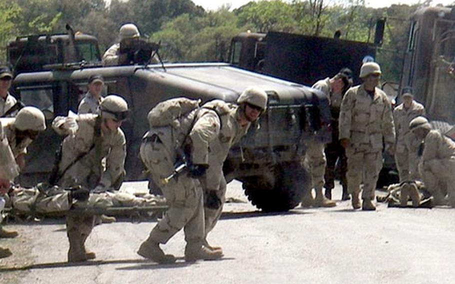 After their convoy was hit by a roadside bomb in Iraq last year, Misawa airmen and the soldiers who were part of their convoy scramble to get an injured servicemember out of harm&#39;s way.