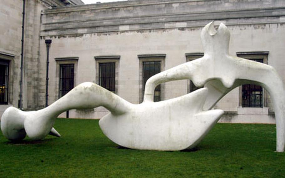 A sculpture sits in front of the Fitzwilliam Museum in Cambridge.