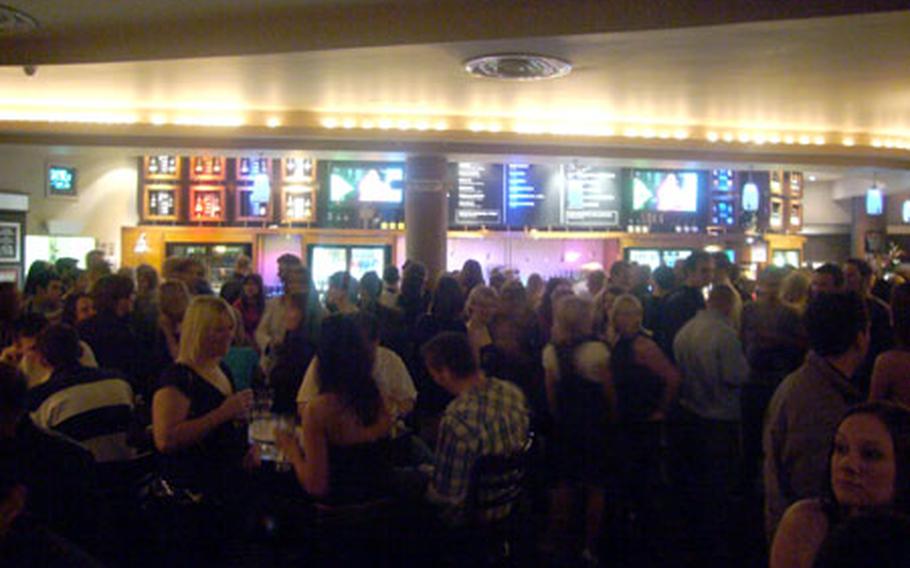 Partygoers at Lloyds No. 1 Bar mingle on a recent Friday night.