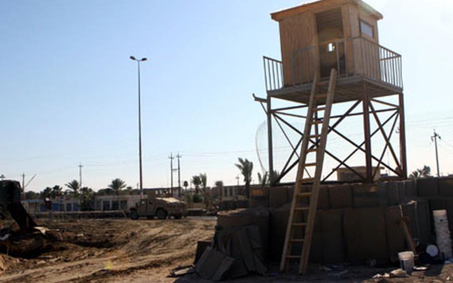 Iraqi police in Khalidiyah, Iraq, are preparing to move back into their station, which Marines from Okinawa worked to rebuild and make more secure.