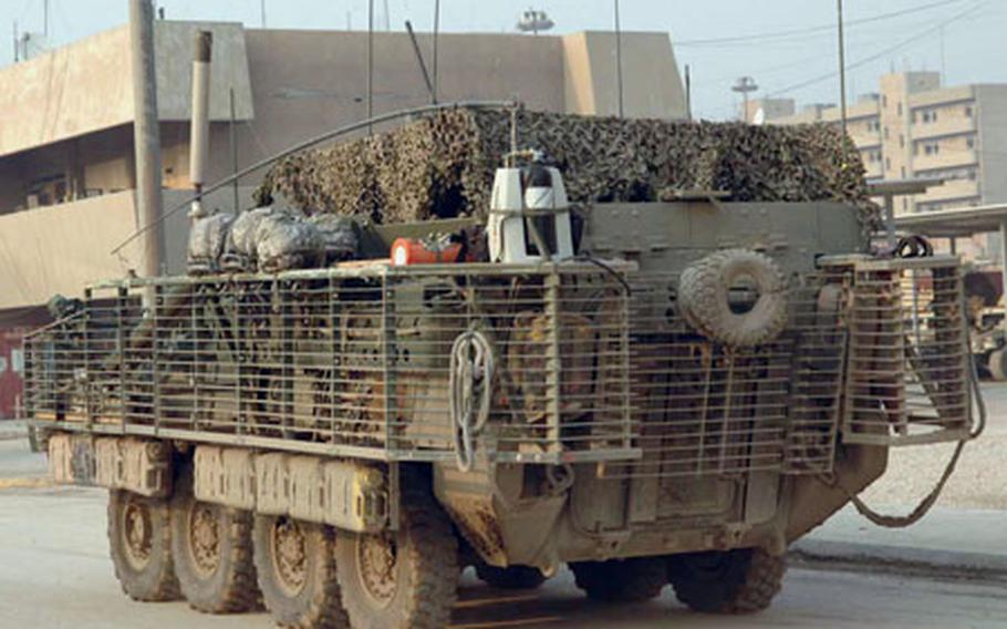 A Stryker wheeled combat vehicle rolls through Forward Operating Base Loyalty in Baghdad.