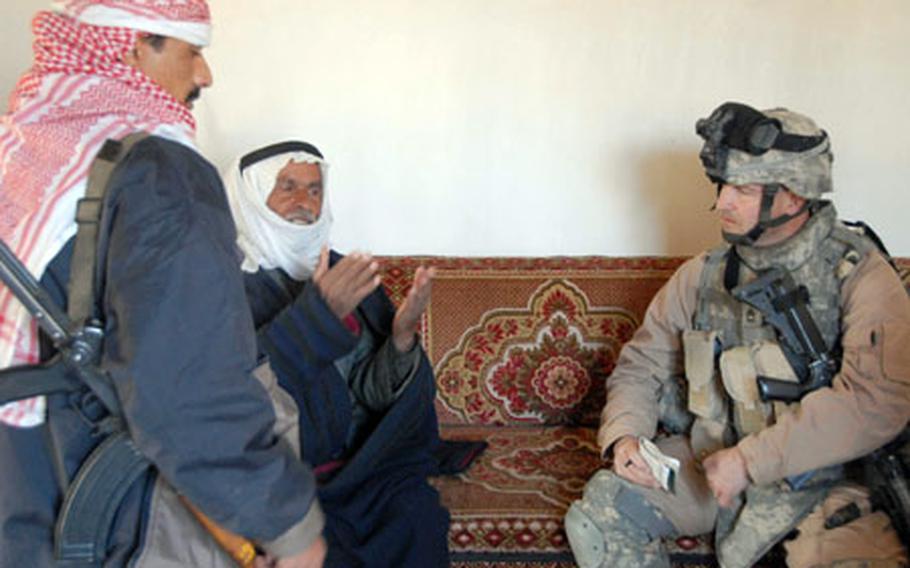Sgt. 1st Class Timothy Leighty, 42, of Kansas City, talks with a homeowner in Albu Faraj about the weapons he had lied about having in the house. Leighty wanted to detain the man, but the Iraqi police, who were leading the neighborhood patrol, said the man wasn&#39;t causing trouble and could stay in the neighborhood.