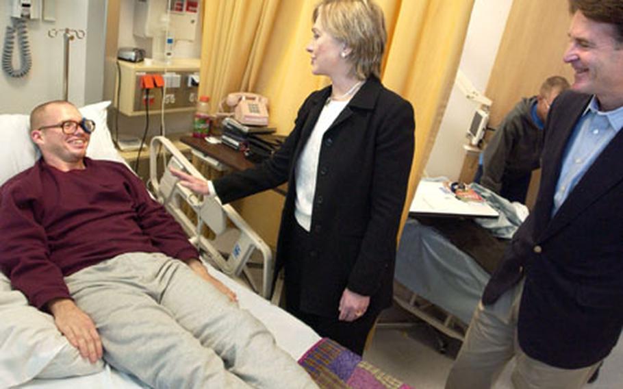 Senators Hillary Rodham Clinton (D-NY) and Evan Bayh (D-IN) visit with Marine Cpl. William Harrelson, 22, at the Landstuhl Regional Medical Center in Germany on Monday. Clinton, Bayh and U.S. Rep. John M. McHugh (R- NY) were headed back to the States are spending time in Iraq, Afghanistan and Pakistan. Harrelson is assigned to the 3rd Battalion, 11th Marines from 29 Palms, California.