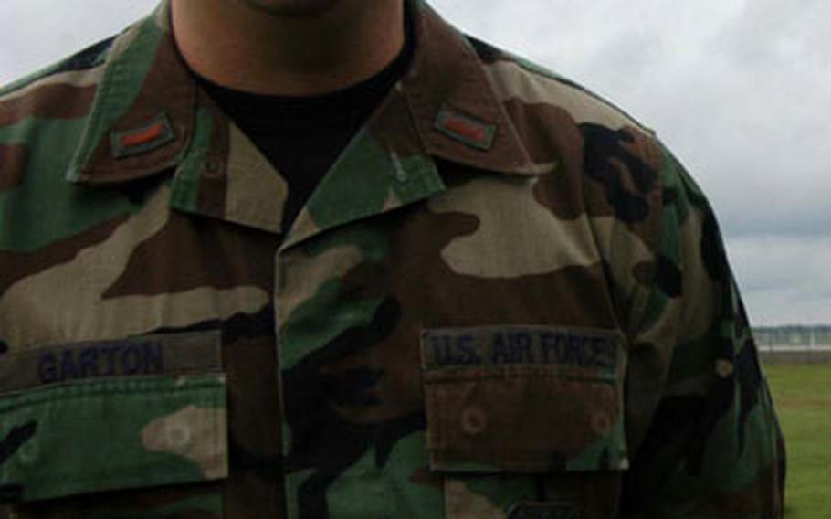 Second Lt. Bryan Garton, wing weather officer for the 48th Fighter Wing at RAF Lakenheath stands under a bank of storm clouds at the base recently.