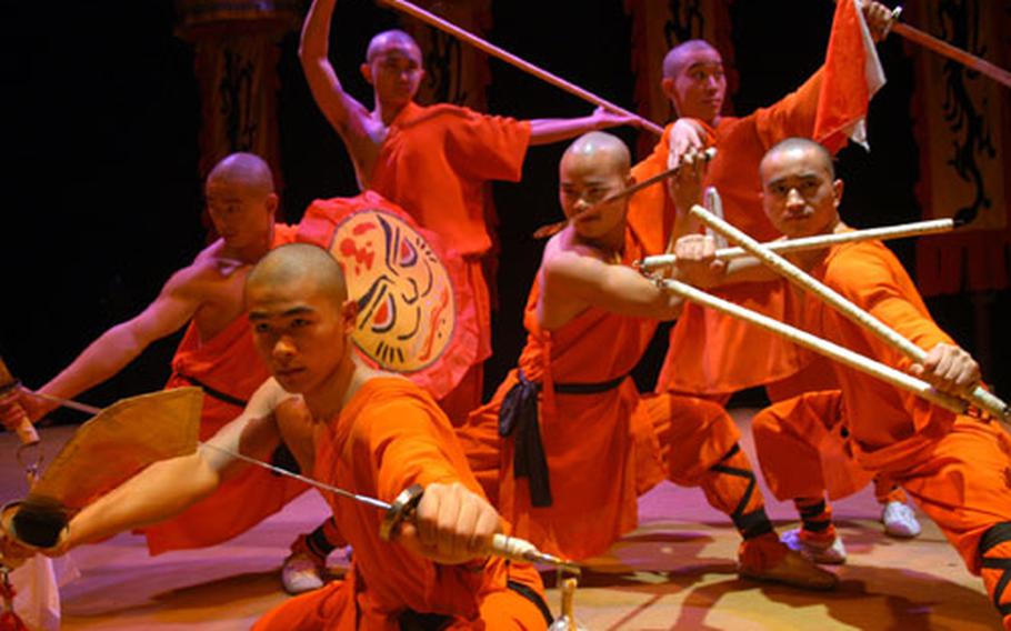 A group of the high-energy and acrobatic Shaolin Wu-Shu warriors from the Chinese State Circus get serious before opening their show at the Cambridge Corn Exchange recently. The group appears this weekend in London and next week in Peterborough.